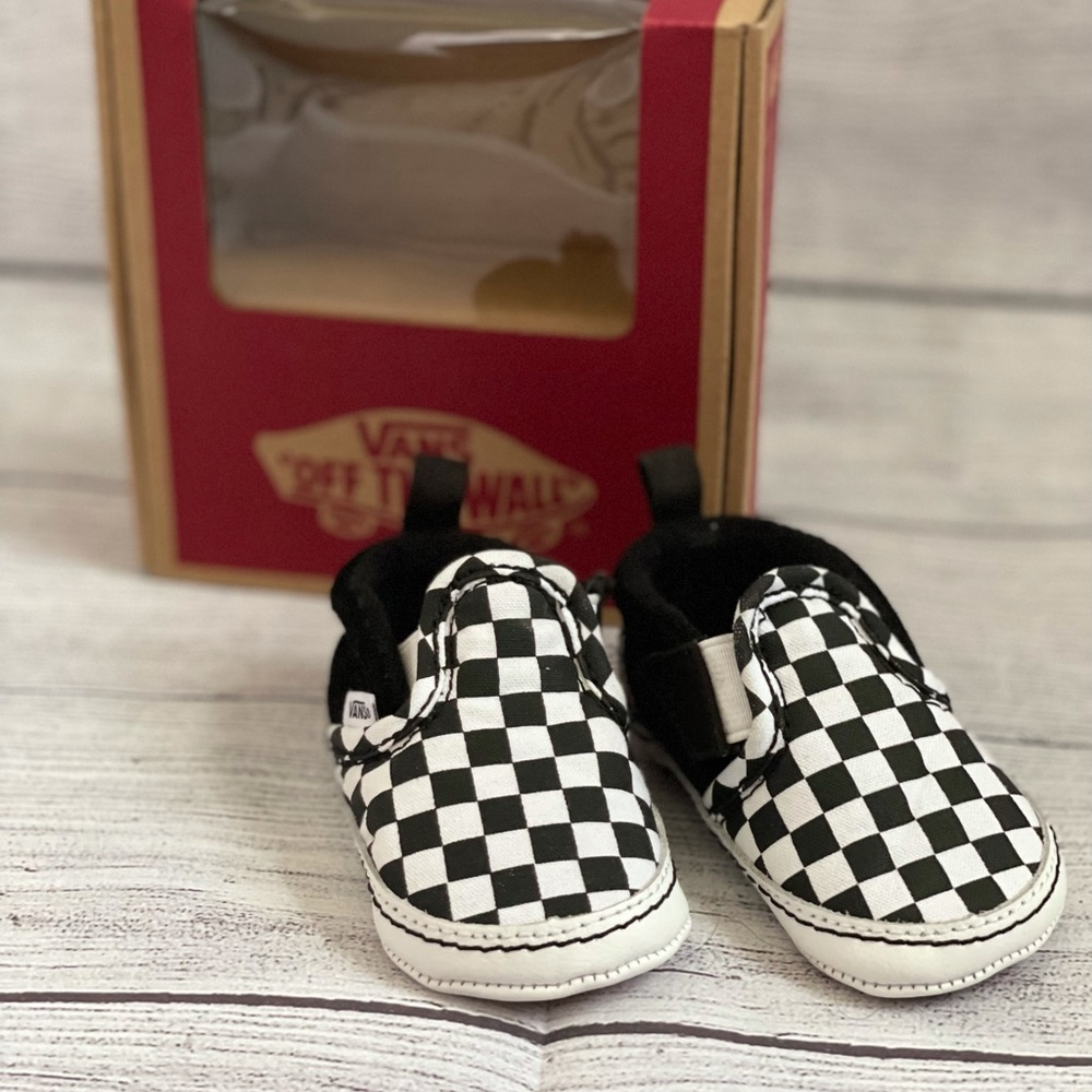 Checkered black & white slip on crib vans, size 3.